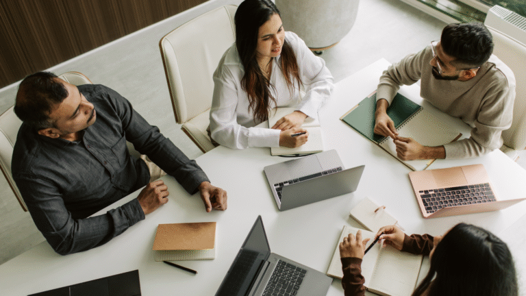 A team of Indian engineers in a meeting room